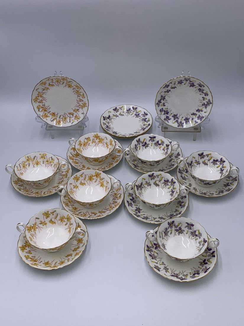 Cauldon Pottery Tea cup & Saucer Plates with Flower Design: Cauldon Pottery Tea cup & Saucer Plates with Flower Design. (4) Double handle tea cups with yellow flower design measures 2 1/4" tall x 6" wide. (6) Saucer plater with yellow flower design measures 1"