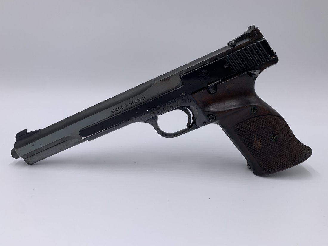 Smith & Wesson Model 41-1 .22 Short Semi-Automatic Pistol: Smith & Wesson Model 41-1 .22 Short Semi-Automatic Pistol. Serial No.27943. The barrel measures 7". The pistol comes with 2 magazine. In good condition. $65 will be added to all firearms sold online f