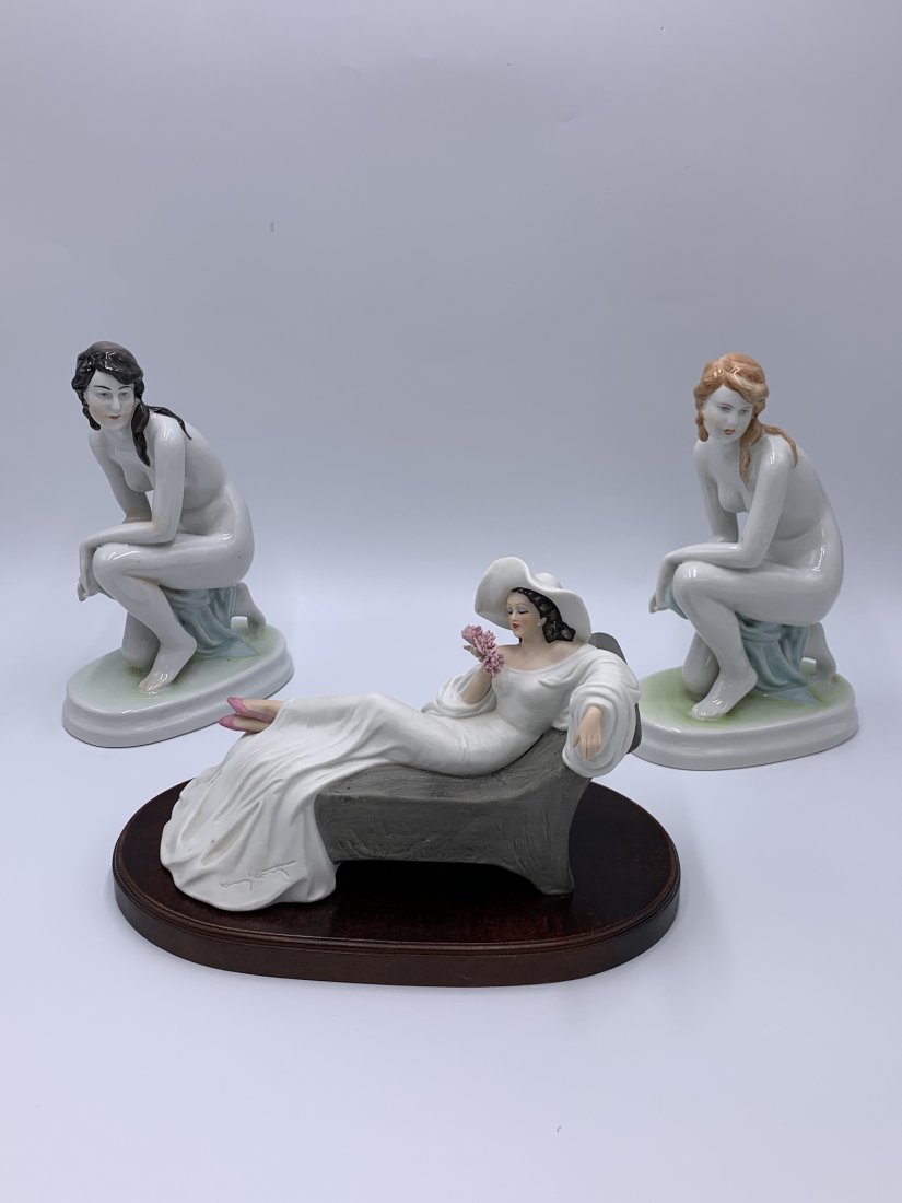 Lot of Zsolnay & The Heirloom Porcelain Louis Icart Figurine: Lot of Zsolnay & The Heirloom Tradition Porcelain Figurine. Pair of Hungarian Zsolnay Hand Painted Nude Women Porcelain Figurines kneeling with a blue cloth. Signed by artist & makers mark on the bott