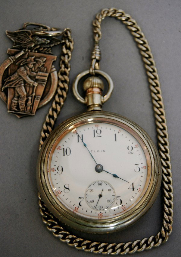 ELGIN POCKET WATCH: ELGIN OPEN FACE POCKET WATCH AND FOB, FIREMAN EMBOSSED ON WATCH CASE AND FIREMAN FOB.