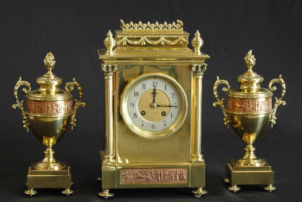 SCOTTISH CLOCK SET: 3 PIECE SCOTTISH BRONZE AND COPPER MANTLE CLOCK SET WITH FRENCH MOVEMENT BY ALEXANDER & SON WITH PORCELAIN FACE.