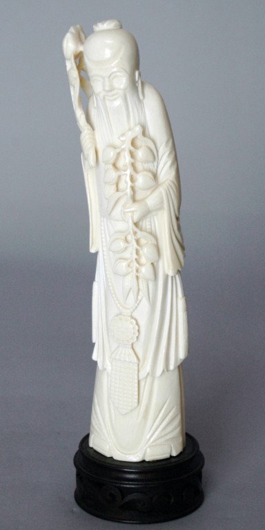 CARVED IVORY TUSK: TALL CARVED IVORY TUSK , ONE OF THE GODS OF FORTUNE, 10".
