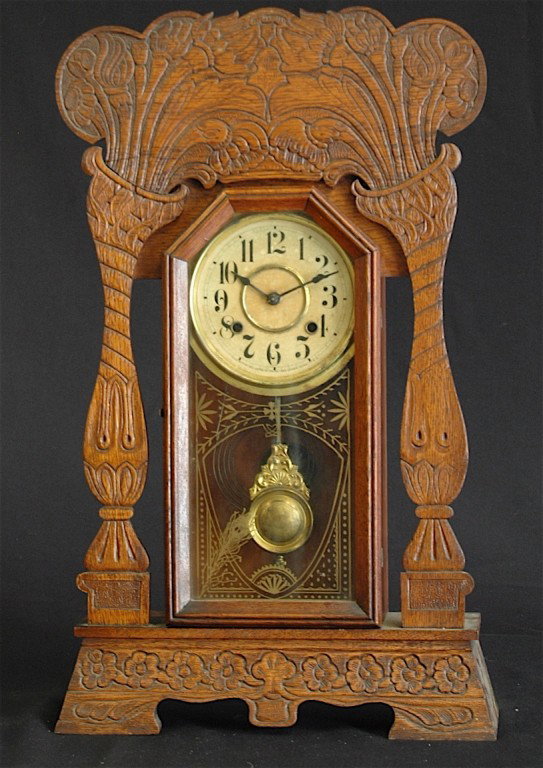 OAK GINGERBREAD MANTLE CLOCK: LARGER THAN USUAL OAK GINGERBREAD MANTLE CLOCK MADE IN NEW HAVEN, CT. USA, CHIME AND TIME, 25", WORKS.