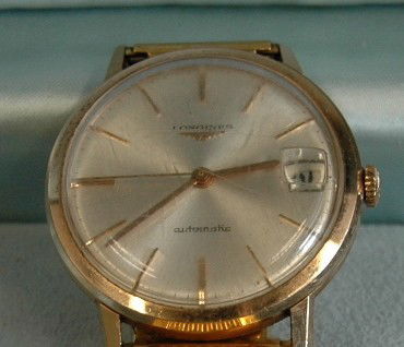 Longines 18K Gold Man's Watch: Longines 18K gold man's wrist watch, 245. Automatic with date adjust, original box and tags from 1965.