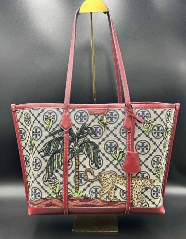 Tory Burch Monogram Jacquard Embroidered Triple-Compartment Tote: Tory Burch Perry T Monogram Jacquard Embroidered Triple-Compartment Tote. Signature T monogram topped with graphic jungle print embroidery, framed with a smooth leather trim creates this triple compar