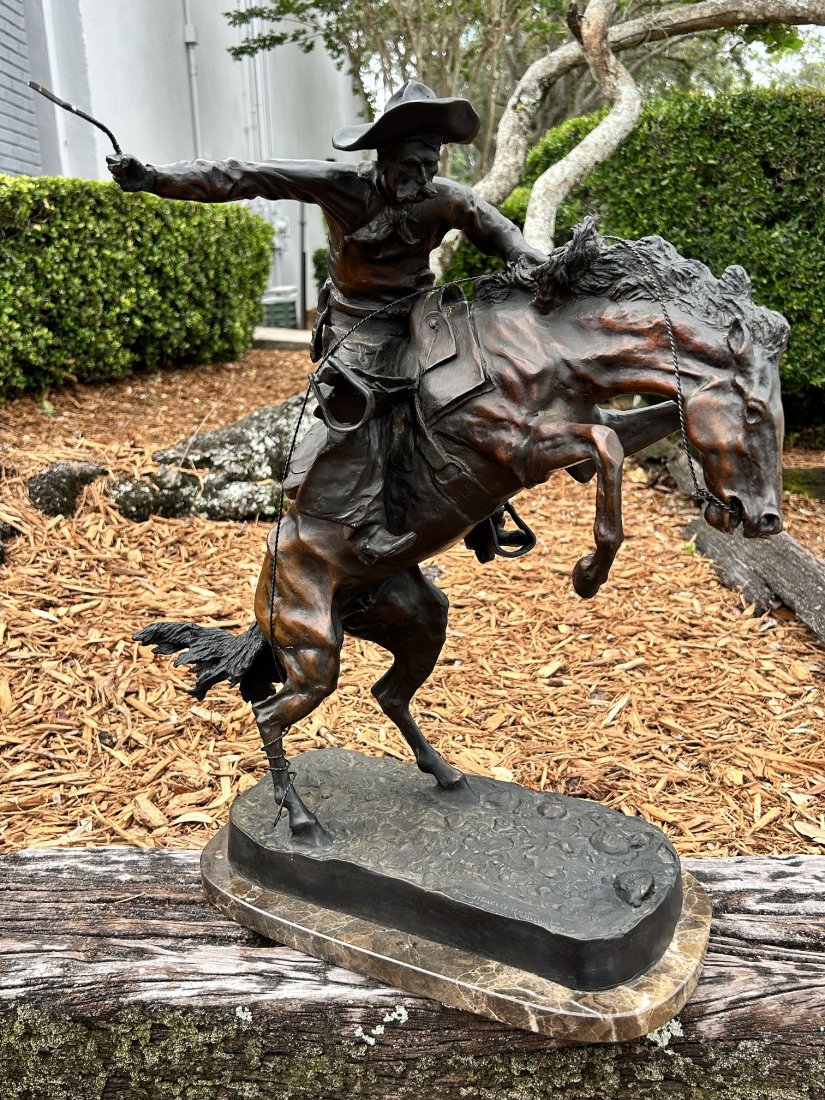 Frederic Remington Bronze Sculpture -Bronco Buster: Frederic Remington Bronze Sculpture -Bronco Buster. Signed & numbered on the base 7/100.The bronze sculpture measures 22" tall x 24" wide x 10" depth. Weight: 64.5 Lbs. Please refer to all pictures. I