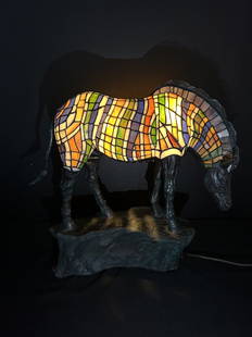 Large Signed Stained Glass Zebra Lamp on Bronze Base: Large Signed Stained Glass Zebra Lamp on Bronze Base. Amazing lighted in oranges, blues, yellow, green and white stained glass. The Zebra measures 21" tall x 23" wide from tail to nose and 8" in