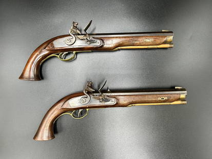Pair of Flintlock 50 Caliber Dueling Pistols: Pair of Flintlock 50 Caliber Dueling Pistols. The barrel measures 10" length. The wooden handle to the tip of the barrel measures 16" length. Combined weight: 5.5 Lbs. Please refer to all