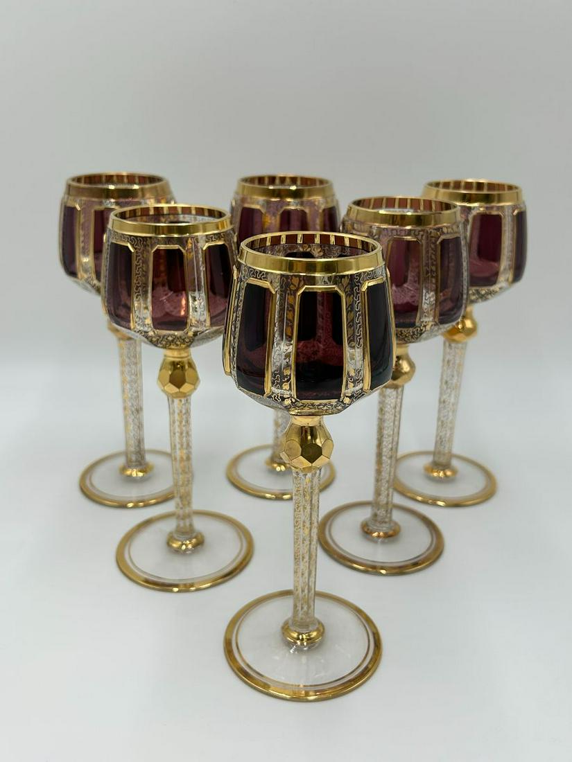 Lot of 6 Moser Cabochon Amethyst Wine Goblets: Lot of 6 Moser Cabochon Amethyst Wine Goblets. Beautiful amethyst windows of glass framed and decorated throughout with gold. Each goblet measure 7 3/4" tall. The combined weight is 3lbs. No chips. Pl