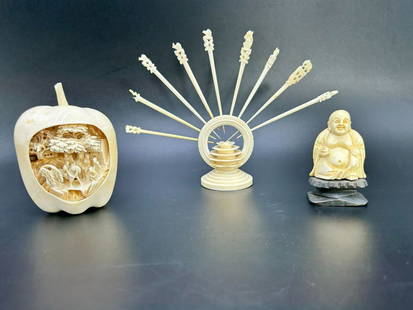 Asian Hand Carved Apple, Buddha & Set of Cocktail sticks with Stand: Asian Hand Carved Apple, Buddha & Set of Cocktail sticks with Stand. (1) Hand carved apple with village scene. The carved apple measures 4" tall x 3" wide. Missing stem. (1) Set of cocktail sticks wit
