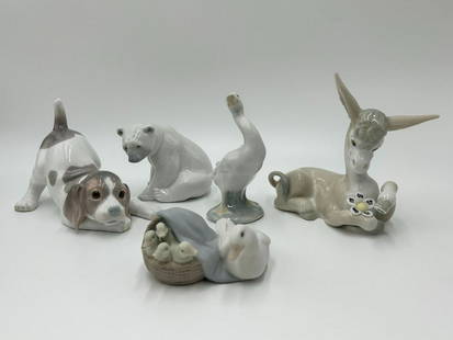 Lot of 5 Lladro Animal Figurines-Beagle, Donkey, Polar Bear: Lot of 5 Lladro Animal Figurines. (1) The beagle dog figurine measures 4 1/2" tall x 6" wide. (1) Donkey in love figurine measures 5 1/2" tall x 6" wide. (1) Seated polar bear figurine measures 3" tal