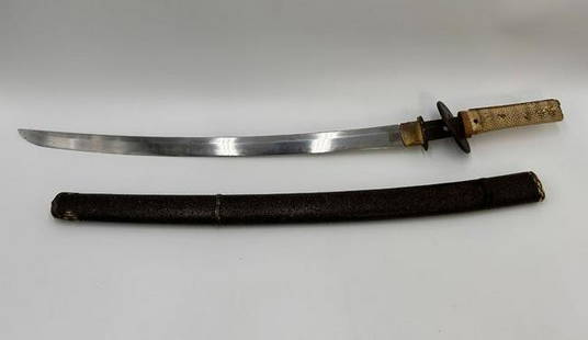 Japanese Wakizashi Sword with Shark Skin on Handle: Japanese Wakizashi Sword with Shark Skin on Handle. The Wakizashi sword & sheath measures 27 1/2" length. The sword has a chip on the tip of the blade. The Wakizashi sword measures 25" long (handle to