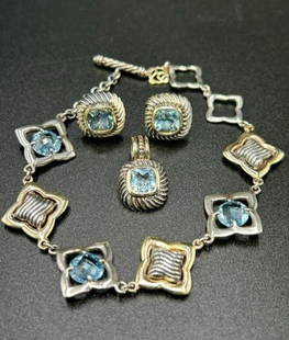 David Yurman Lot of 18K, 14K, Sterling and Blue Topaz Jewelry: David Yurman Lot of 18K, 14K, Sterling and Blue Topaz Jewelry. (1) David Yurman 18K and Sterling Silver Blue Topaz Quatrefoil Link Bracelet. The braclet measure 8" in length but could be fastenened at