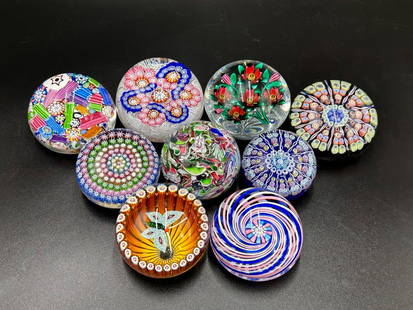 Lot of 9 Millefiori and Assorted Paperweights: Lot of 9 Millefiori and Assorted Paperweights. They measure from the largest at 9" circumference to the smallest at 7.25" Circumference. The Orange Butterfly paperweight is signed by William Manson. T