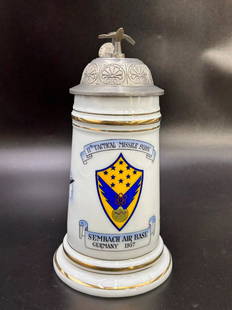 Schmidt Koblenz Sembach Air Base Germany 1957 Beer Stein: Schmidt Koblenz Sembach Air Base Germany 1957 Beer Stein. 11th Tactical Missle SQDN. on the front with logo Badge. The stein also depicts painted jets with a pewter lid topped with jet. The beer stein