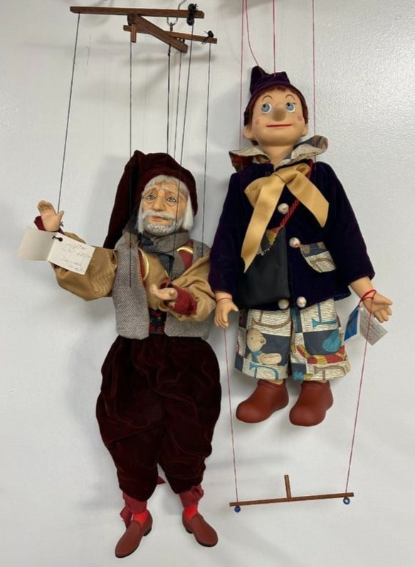 Pair of Signed and Numbered Pinocchio and Geppetto Marionettes by Daniela di Mazzolani: Pair of Signed and Numbered Pinocchio and Geppetto Marionettes by Daniela di Mazzolani. There Marionettes are made in Italy, tags are signed and numbered by the artist. 1). Pinocchio Burattino is numb