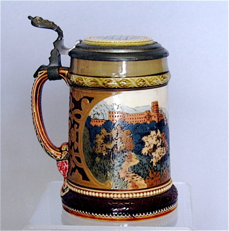 Mettlach Stein # 2277: Mettlach stein # 2277, .3L, inscription on porcelain lid, castle overlooking river scene, good condition.