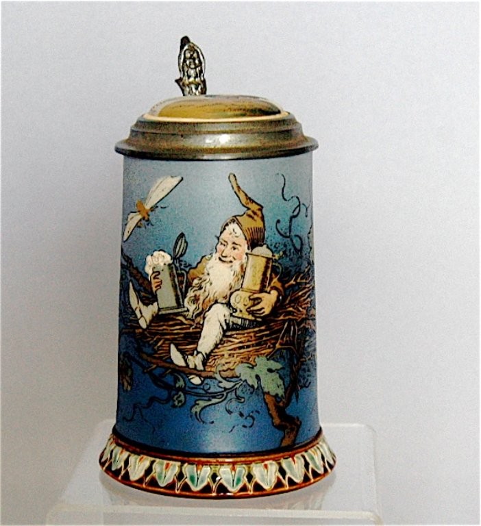 Mettlach Stein # 2134: Mettlach stein # 2134. .3L, gnome with stein and flagon, rooster in nest at sunrise on lid, good condition.