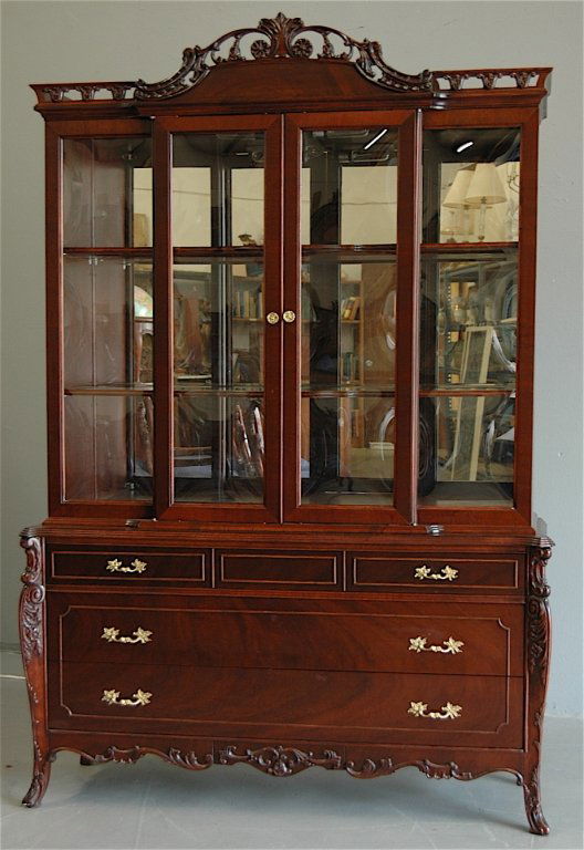 Mahogany Dining Room Set 16 pieces: 16 piece carved mahogany dining room suite: 12 upholstered chairs, server (34h, 40w, 20d), buffet (approx. 70w), dining table (65L, 43w, 30.5H) 3 apron leaves 12" wide, extends to 101", china cabinet