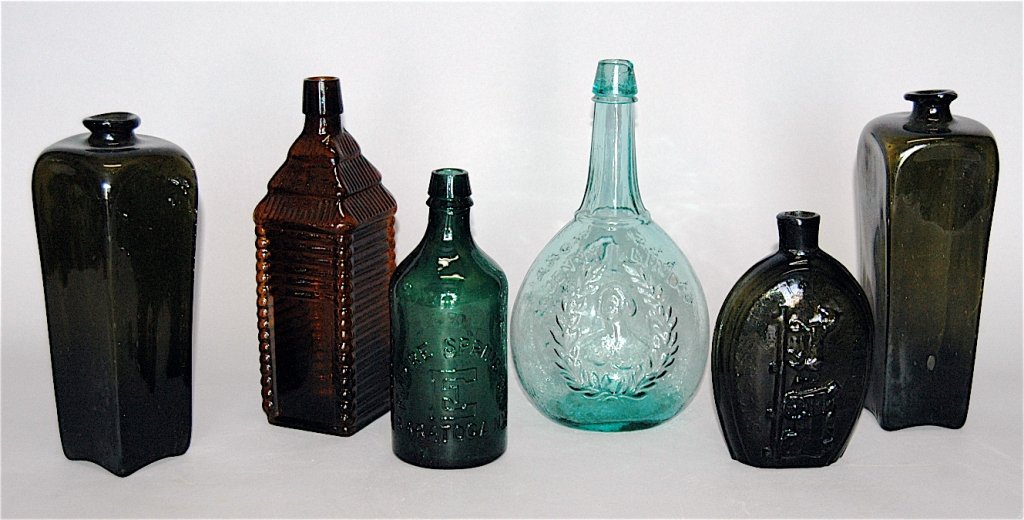 Group of 6 Antique Bottles, including R.R. Bottle: Group of 6 antique bottles: 2 early olive rum bottles, Drake 1860 Plantation bitters, Empire Spring Co. Saratoga, NY, Jenny Lind Glass works, S. Huffsey, success to the Railroad, 5 good condition, 1 r