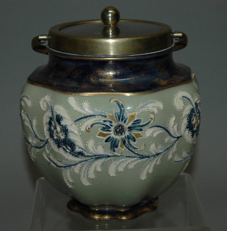 James McIntyre and Company Biscuit Jar: James McIntyre & Co. (pre Moorcroft), "Gesso Faience" biscuit jar with squeeze bag decoration, designed by Harry Barnard (contemporary of William Moorcroft), c 1896, EPNS bail and lid (monogrammed), s