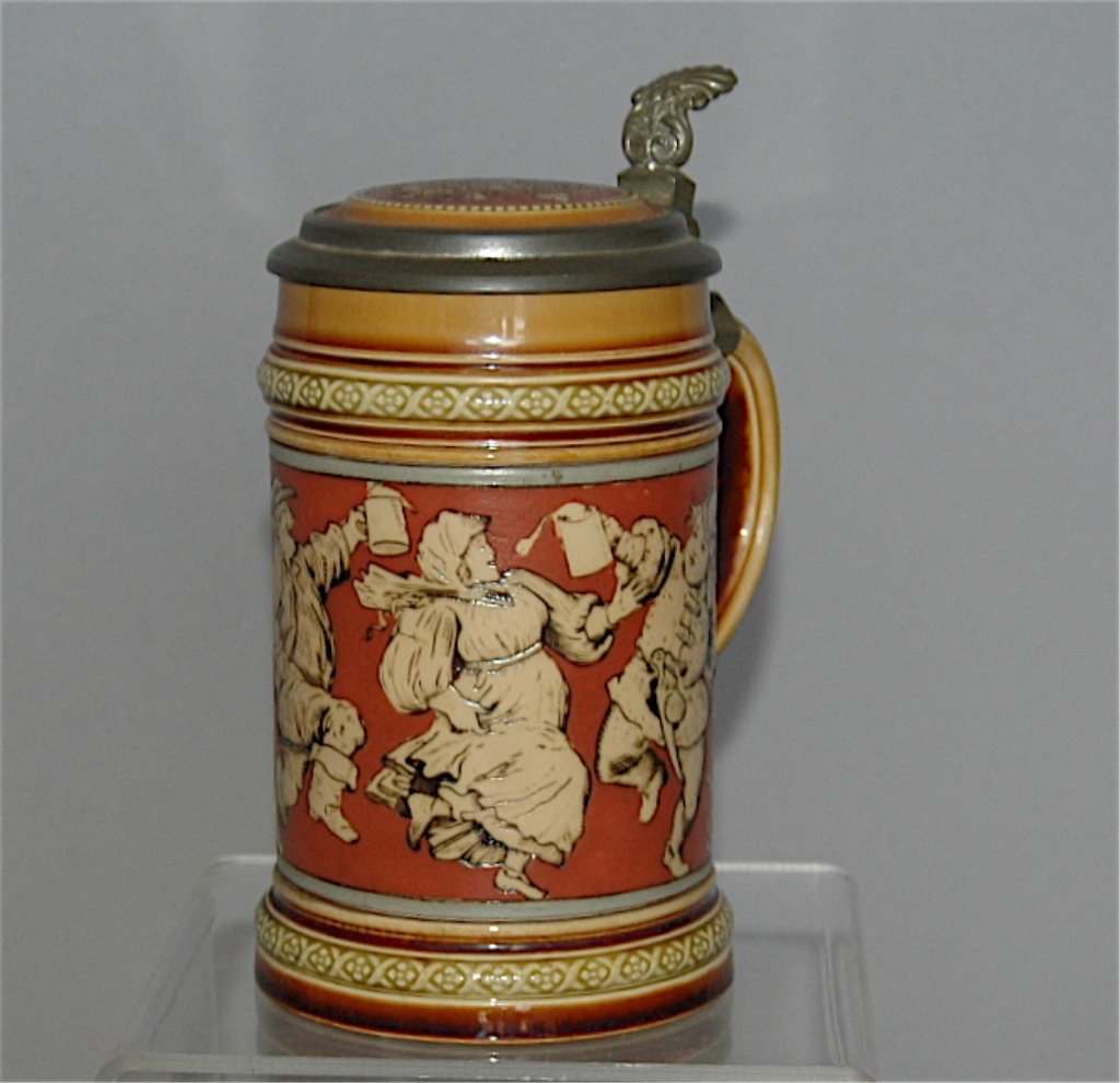 Mettlach Stein # 2057: Mettlach stein # 2057, .3L etched on porcelain lid with 7 dancing figures, good condition.
