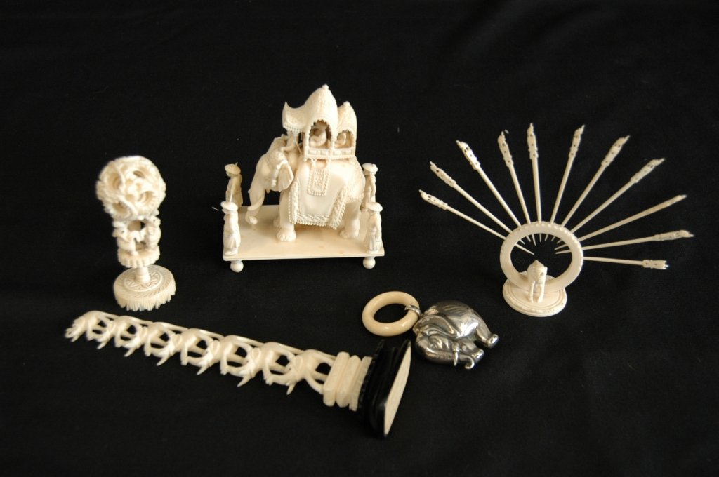 5 Piece Group Indian Ivory: 5 piece group of Indian ivory: elephant with hookah on stand, stacked graduated elephants, mystery ball on stand, hors d'oeuvre picks and sterling & ivory teething ring, good condition.