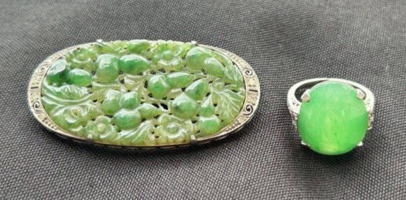 Estate Lot of Platinum Jade & Diamond Art Deco Brooch & Ring: Estate Lot of Platinum Jade & Diamond Art Deco Brooch & Ring. Oval Jadeite Flowered Brooch surrounded by platinum art deco motif with diamonds. The brooch measures W 2" x H 1". Art Deco Platinum Jade