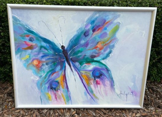 Louise Hubyack Butterfly Oil on Canvas Art: Louise Hubyack Butterfly Oil on Canvas Art. Large beautiful Butterfly art in bright pastel colors. Signed on bottom right by artist Louise Hubyack B 1916 - D 1991. The frame shows signs of age. The ar