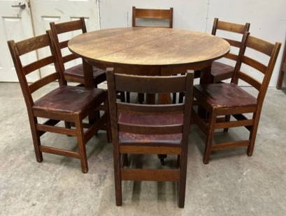 Mission Oak L. & J.G Stickley Arts & Crafts Dining Table with Chairs and 4 Leaves: Mission Oak L. & J.G Stickley Arts & Crafts Dining Table with Chairs and 4 Leaves. This is a 48" , 5 legged table with 4 leaves still in the original box. There is quite a color transformation from