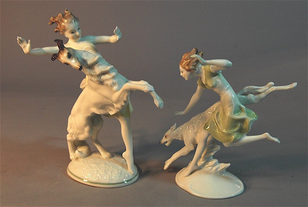 2 Hutschenreuther Porcelain Figurines: 2 Hutschenreuther porcelain figurines of girls frolicking with Borzoi dogs, largest is 8" which is also marked K. Tutter, both mint.