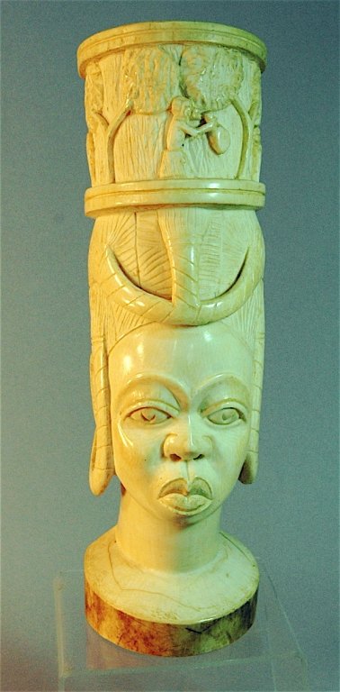 Carved African Ivory Bust: Carved African ivory bust of woman with large detailed headdress, 13" tall, unsigned, excellent condition.