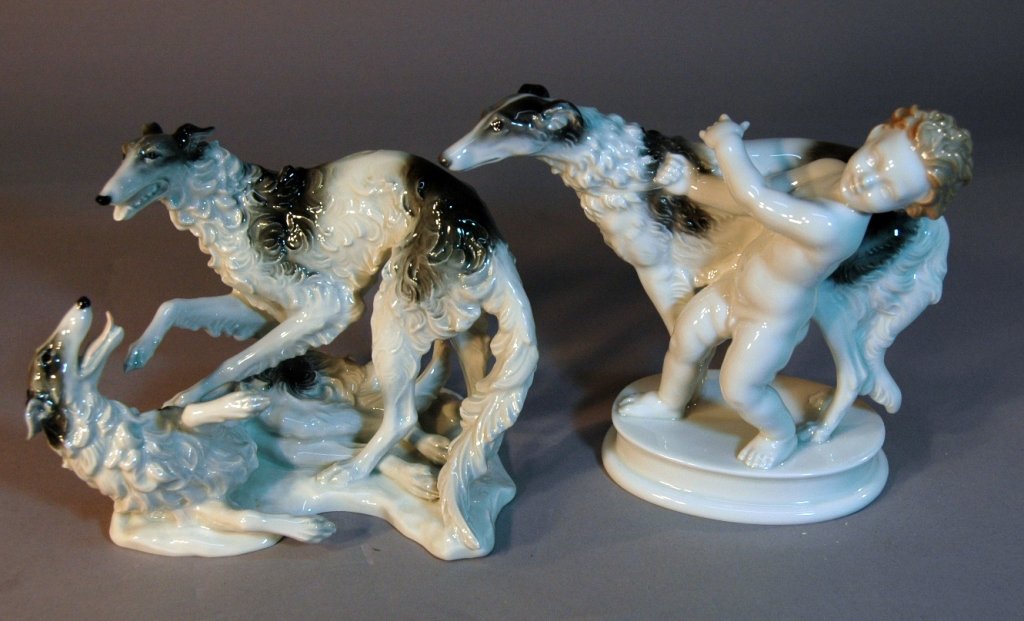 2 Rosenthal Porcelain Figurines: 2 Rosenthal porcelain figurines: 2 playful Russian wolfhounds, 6.5" tall, 8" long, mint condition. Putti holding collar of Borzoi , 6.5" tall, 8", mint.