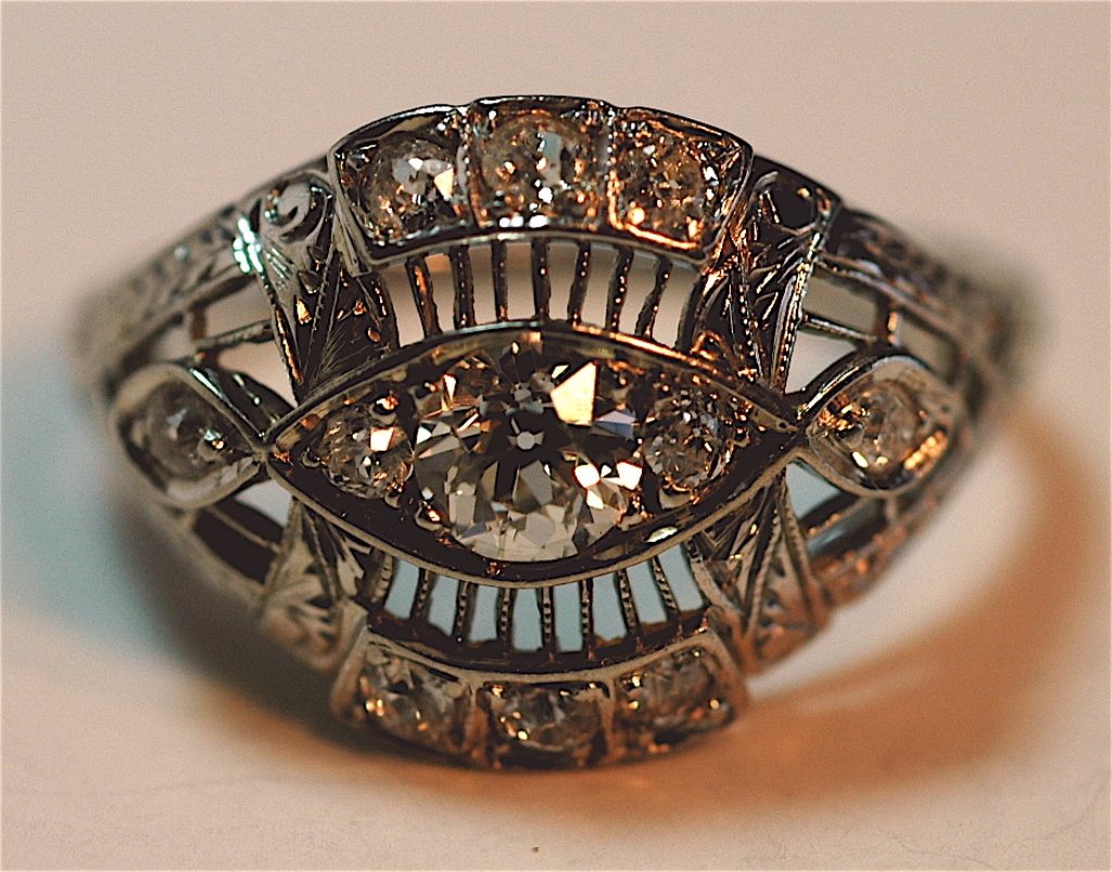 Edwardian Diamond Ring in 14K: Edwardian diamond ring set in 14K white gold, center stone .30 carat with 10 more round cut diamonds.