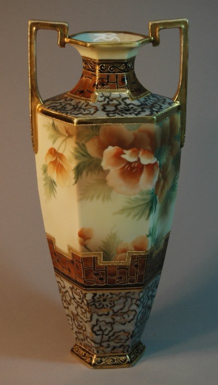 Nippon Porcelain Vase: Large and impressive Nippon porcelain vase, 14" tall, floral decoration lots of gold on double handles, beading, good condition.