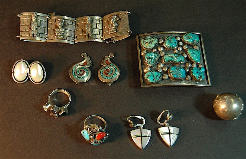 Group of Southwest Native American Jewelry: Group of Southwest Native American jewelry: belt buckle with 9 embedded turquoise stones signed AJW, 6 link bracelet with Mayan idols signed ES, abalone cabochon clip earrings .925, Turquoise and cora