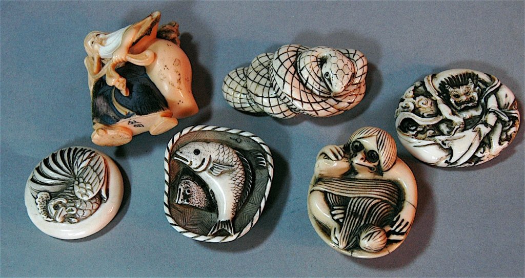 Group of 6 Ivory Netsukes: Group of 6 ivory netsukes: Hasayki Bird man in bowl, bearded elder with sack and monkey on back, Hideyuki devil man with cape, Koumei rooster, 2 fish in basket, all signed, all ivory, all good conditi