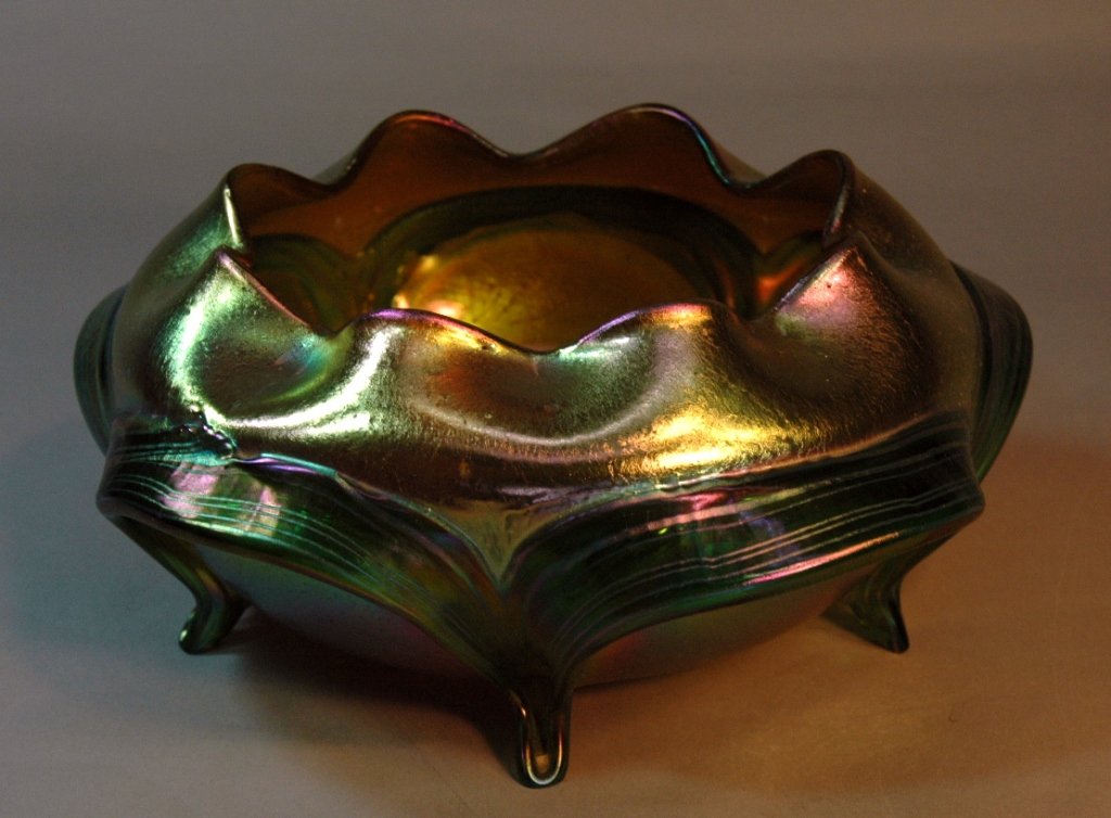 Loetz "Phanomen Genre" Footed Bowl: Loetz "Phanomen Genre" 5 footed bowl, crimped top, undulating striped ribbons making the foot, unsigned, 8.5' d, 3.5h. Four of the five feet have been polished but otherwise good condition.