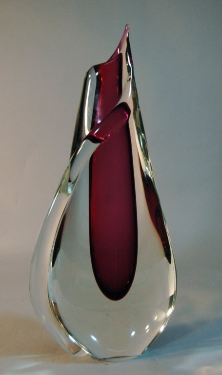 Sommerso Vase, Murano, Italy: Sommerso Vase, Murano, Italy, attributed to Flavio Poli. Deep red "well" encased in clear glass with tail wrapping around from top to bottom. This large 17.5" tall beauty has illegible plastic label,