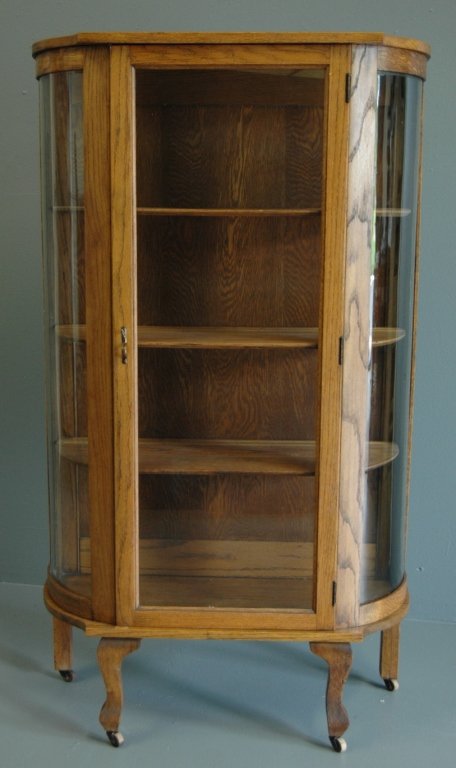 Oak Bow Glass China Cabinet: Oak bow glass china cabinet, 3 shelves, bowed sides, restored finish, 61h, 36w, 14d.