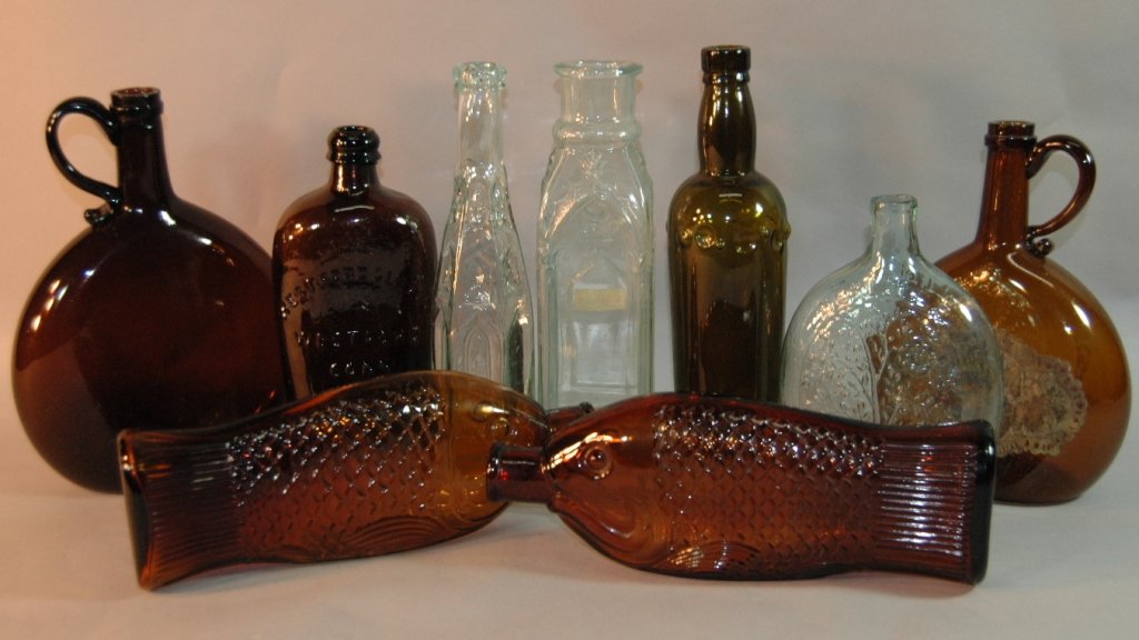 Group of 9 Antique Bottles: Group of 9 antique bottles to include; 2 Catheral pickle /pepper bottles, shaft of Wheat and Star Westford, CT, Summer-Winter flask, figural fish bottles, 2 Hennessey Cognac bottles, olive green beer 