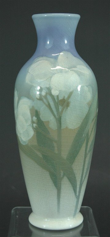 Rookwood Iris Glaze Vase by Sara Sax: Rookwood Iris glaze 9.5h vase, by Sara Sax, dated 1902, shape 562, florals in white and green with pastel blue top. Xed but no chips or cracks, fine crazing.