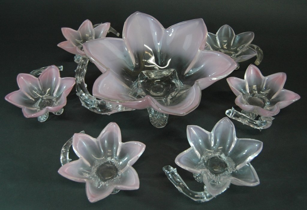 7 Piece Colored Glass Berry Set: 7 piece pink colored glass berry set, all in a floral shape with clear applied thorn handles. Attributed to Stevens and Williams, England, c 1875, very good condition. Large bowl 10dia, 4.5h. Small 5d