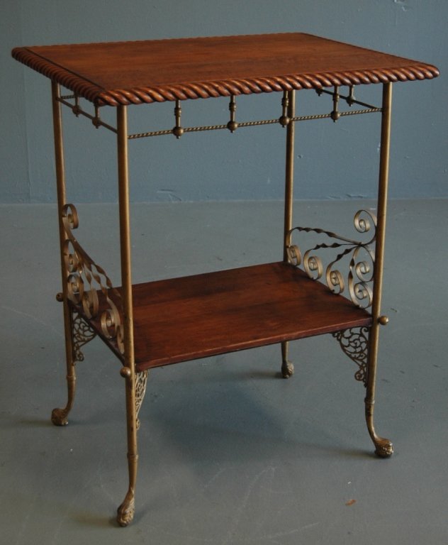 Cherry and Brass Occasional Table: Unusual cherry and brass occasional table. Cherry top has rope carved edge, ornate brass apron, legs and sides. 31h, 24.5, 18.5h, good condition.