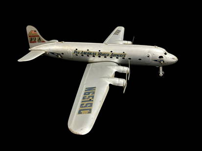 Marx Pressed Metal Toy Model DC4 PAN AM WORLD AIRLINES AIRPLANE N6519C: Marx Pressed Metal Toy Model DC4 PAN AM WORLD AIRLINES AIRPLANE N6519C . This is a large metal airplane replica (Circa 1950) measuring wing span 28" x body length 22" x 4" height and weighs 3 lbs. 
