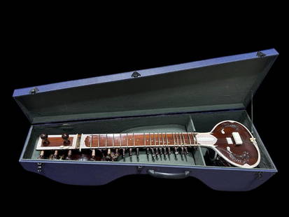 Professional Sitar made by Monoj Kumar Sardar & Bros with case: Professional Sitar made by Monoj Kumar Sardar & Bros with case. This musical instrument was made by the sons of Khagen Sardar. Professional quality, double toomba, 5 main, 2 chikari and 13