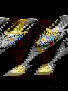 Pair of 19th Century Dagoty A Paris Hand Painted Porcelain Urn Vases: Pair of 19th Century Dagoty A Paris Hand Painted Porcelain Urn Vases. Beautiful pair of French handle urns in gilt gold with black oval facings adorned with hand painted fruits and floral on each side