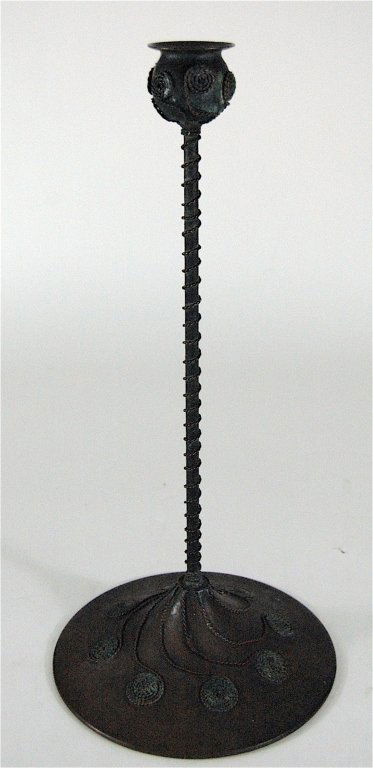 Riviere Studios Bronze Moorish Candlestick: Riviere Studios (unsigned) Moorish candlestick. Original patina, twisted bronze applied to base and candle cup. Cement base rattles, as found condition. 15.5" H. Note: we thought this to be Tiffany an