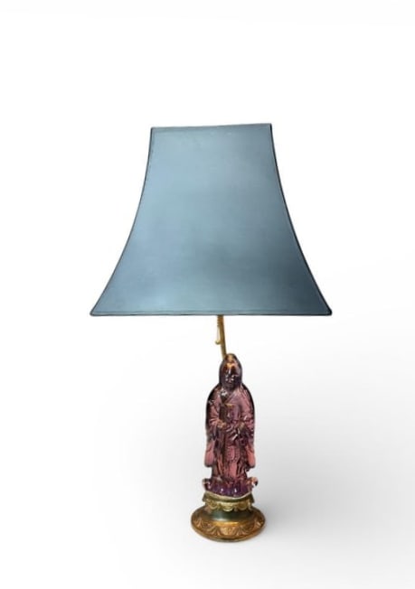 Antique Amethyst Peking Glass Lamp with Shade: Antique Amethyst Peking Glass Lamp with Shade. This is very nice amethyst (lavender) clear glass Buddha princess standing 11" tall on a brass base lamp. There is a black shade with gold foil