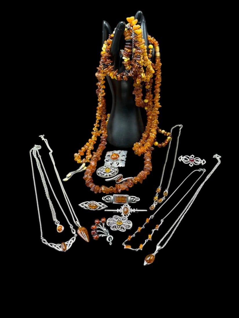 Large Estate Lot Amber & Amber/ Sterling Silver Jewelry, Necklaces, Bracelets, Pendants: Large Estate Lot Amber & Amber / Sterling Silver Jewelry, Necklaces, Bracelets, Pendants. The lot consists of: 4 Amber Stone Bracelets: 2 of the bracelets are stretch with stones, the other 2 have ste